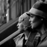 Ruth Negga (left) and Tessa Thompson in a scene from Passing. (Netflix)