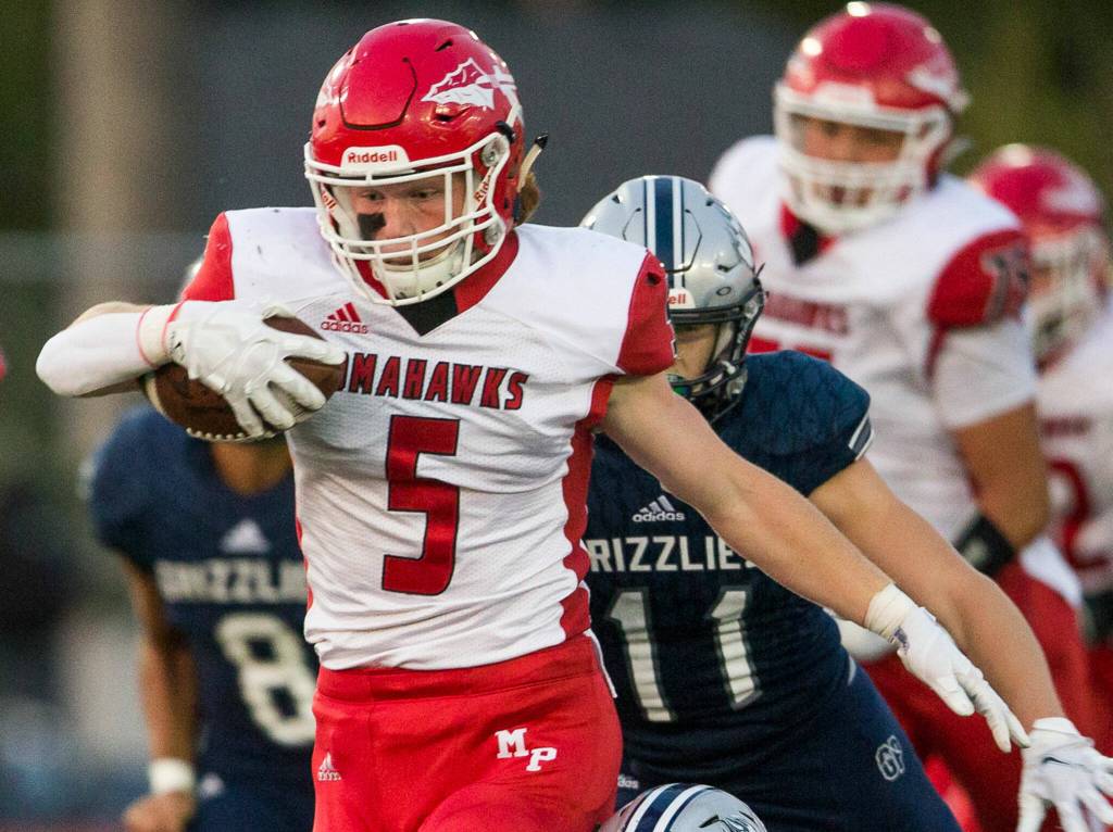 Star running back Dylan Carson and Marysville Pilchucks high-powered Slot-T rushing attack look to keep on rolling in the state playoffs. (Olivia Vanni / The Herald)