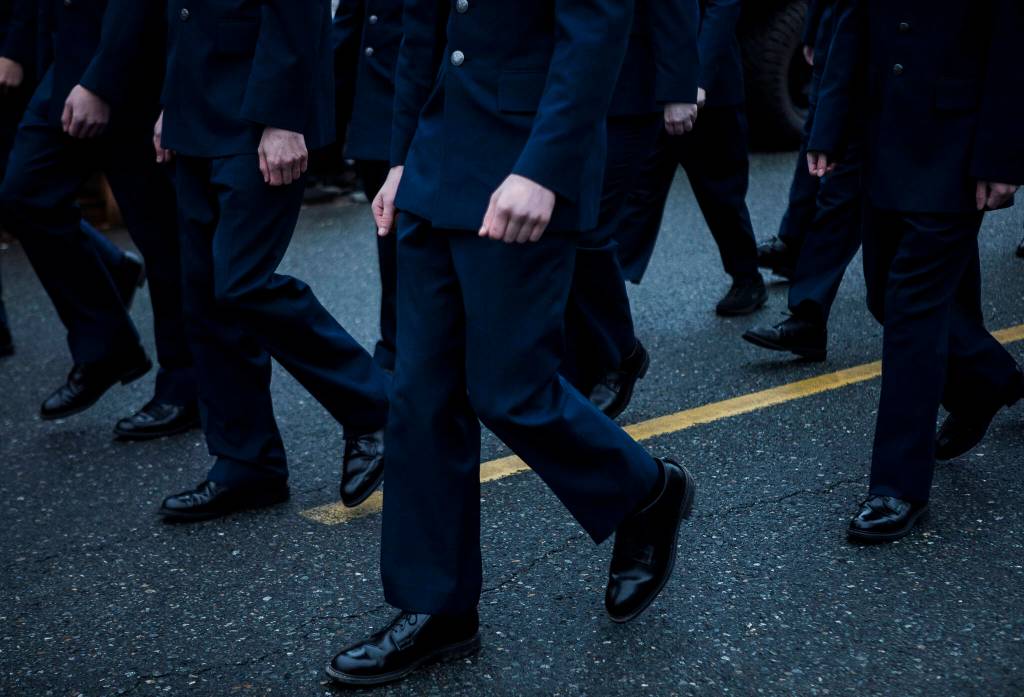 Arlington High School ROTC members walk down Olympic Avenue during the Veterans Day Parade on Thursday, Nov. 11, 2021 in Arlington, Wa. (Olivia Vanni / The Herald)