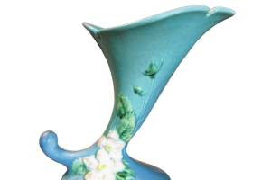 The White Rose cornucopia vase by Roseville Pottery has been reproduced. Authentic vases like this one can sell for $100 to $125. (Cowles Syndicate Inc.)