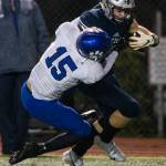 Glacier Peaks Trey Leckner pushes Bothells Sam Stewart while running with the ball on Friday, Nov. 12, 2021 in Snohomish, Wa. (Olivia Vanni / The Herald)