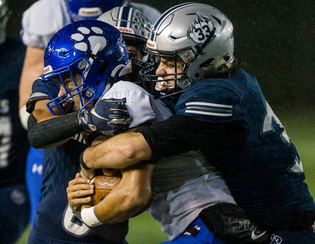 Glacier Peaks Reggie Valmonte tackles Bothells Ahmani Hopoi during the game on Friday, Nov. 12, 2021 in Snohomish, Wa. (Olivia Vanni / The Herald)