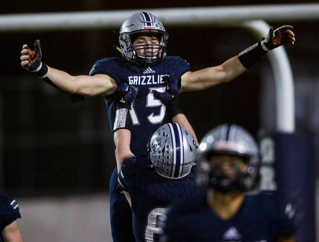 Glacier Peaks Trey Leckner is hoisted in the air by his teammate in celebration of his touchdown during the game against Bothell on Friday, Nov. 12, 2021 in Snohomish, Wa. (Olivia Vanni / The Herald)