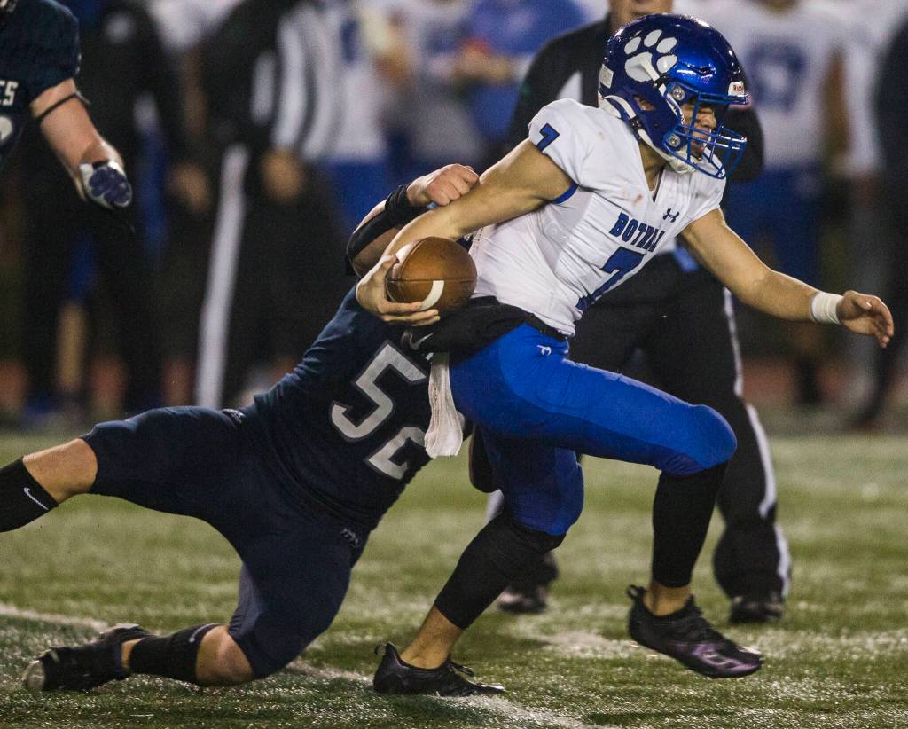 Glacier Peaks Jacob Erickson tries to tackle Bothells Logan Lacio during the game on Friday, Nov. 12, 2021 in Snohomish, Wa. (Olivia Vanni / The Herald)