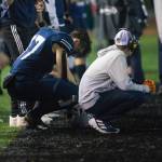 Glacier Peak's Joe Johnson and a coach react to losing to Bothell and being knocked out of the playoffs on Friday, Nov. 12, 2021 in Snohomish, Wa. (Olivia Vanni / The Herald)