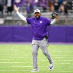 Washington head coach Jimmy Lake walks on the field as he reacts to a call in favor of Arkansas State during a game Sept. 18 in Seattle. (Elaine Thompson / Associated Press)