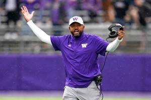 FILE - Washington head coach Jimmy Lake walks on the field as he reacts to a call in favor of Arkansas State in the second half of an NCAA college football game, Saturday, Sept. 18, 2021, in Seattle. Washington on Monday, Nov. 8 suspended head coach Jimmy Lake for one game without pay following a sideline incident during the Huskies' game against Oregon. (AP Photo/Elaine Thompson, File)
