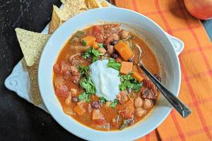 A spicy coconut sweet potato stew is just the thing to take the chill off of a cool autumn evening. (Gretchen McKay/Pittsburgh Post-Gazette/TNS)