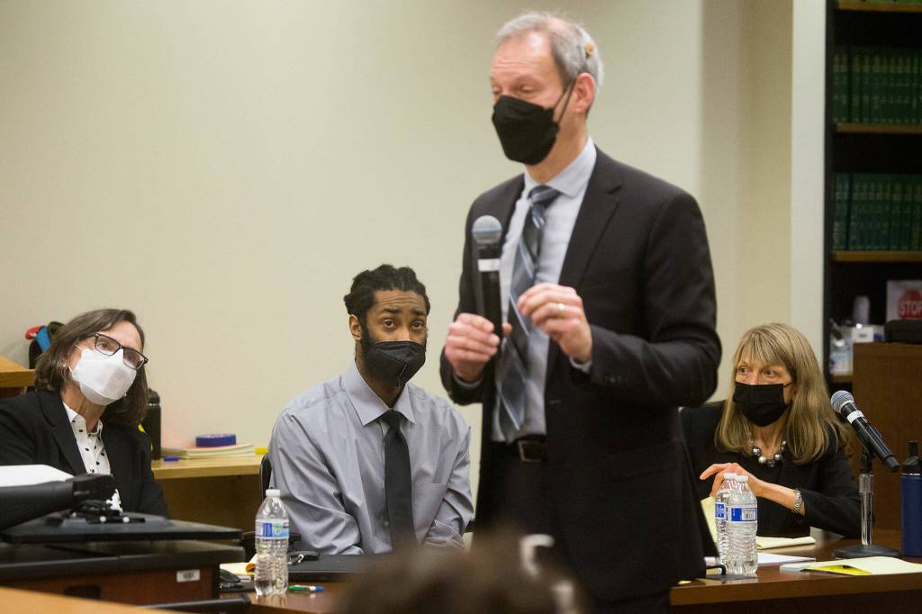 Defendant Kevin Lewis and his attorneys listen to closing arguments by deputy prosecutor Jarett Goodkin in Lewis murder trial at the Snohomish County Courthouse on Thursday in Everett. (Andy Bronson / The Herald)
