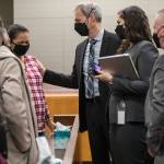 Algeria Canales, a sister of Alisha Canales-McGuire, becomes emotional while speaking with deputy prosecutor Jarett Goodkin, after the jury found Kevin Lewis guilty of first-degree murder Thursday in Everett. (Olivia Vanni / The Herald)