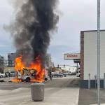 Flames engulfed a van Thursday in downtown Everett. (Phil O'Connor / The Herald)