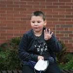 Myles, 5, answers questions about Thanksgiving outside Mt. Pilchuck Elementary on Monday in Lake Stevens. (Andy Bronson / The Herald)
