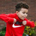 Kindergartener Robert, 5, imitates a turkeys actions as he answers questions about Thanksgiving outside Mt. Pilchuck Elementary on Monday, Nov. 22, 2021 in Lake Stevens, Washington. (Andy Bronson / The Herald)
