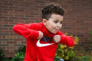 Kindergartener Robert, 5, imitates a turkeys actions as he answers questions about Thanksgiving outside Mt. Pilchuck Elementary on Monday, Nov. 22, 2021 in Lake Stevens, Washington. (Andy Bronson / The Herald)