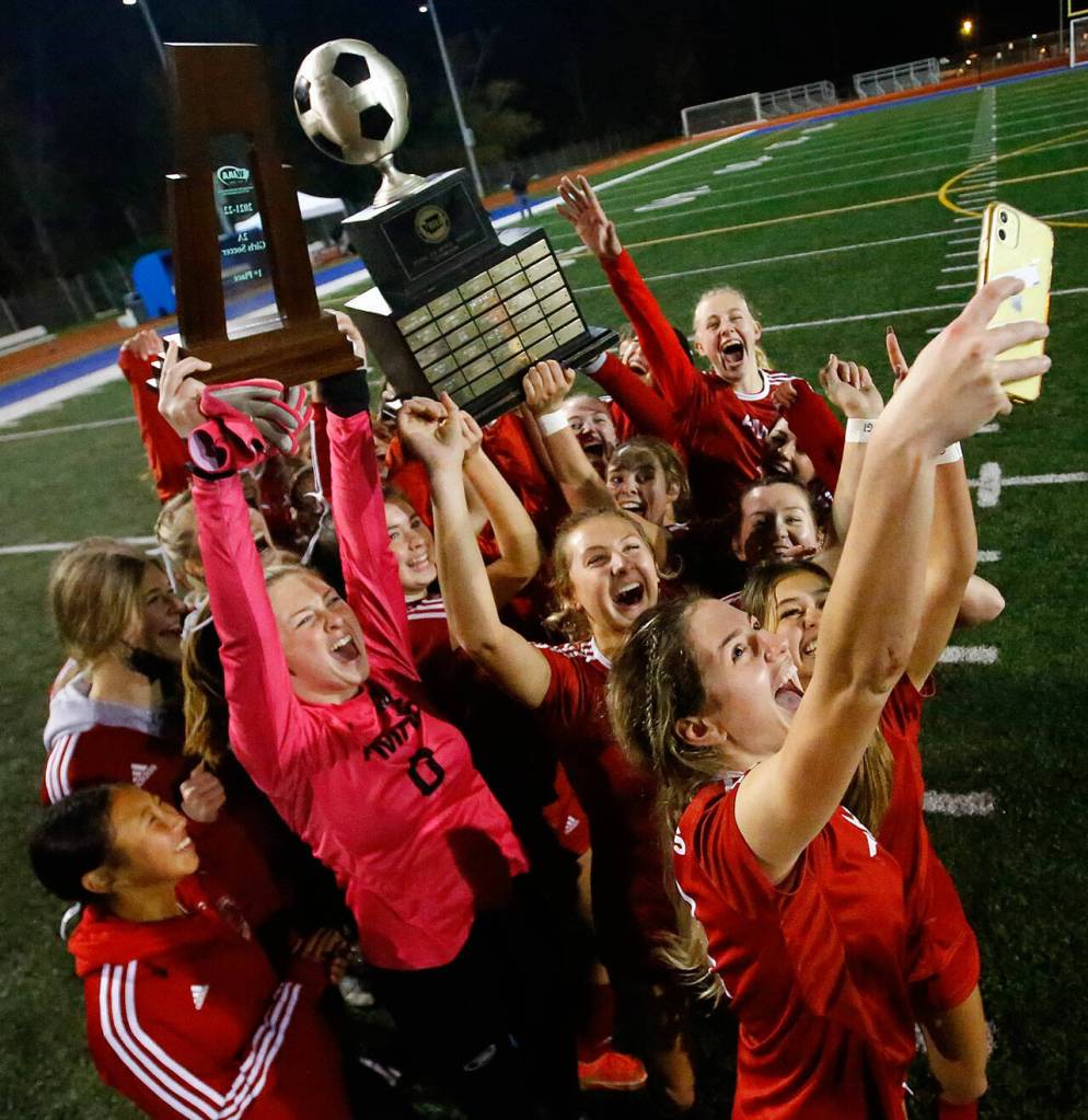Archbishop Murphy celebrate their win for a social media posting Saturday evening against Hockinson for 2A state championship at Shoreline Stadium on November 20, 2021. The Wildcats won 2-0. (Kevin Clark / The Herald)