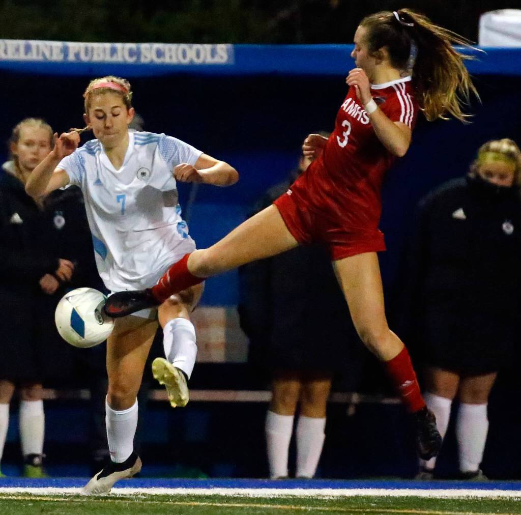 Archbishop Murphys Cameron Bourne, right, kicks the ball from Hockinsons Rayelle Stephens Saturday afternoon during the 2A state championship at Shoreline Stadium on November 20, 2021. The Wildcats won 2-0. (Kevin Clark / The Herald)