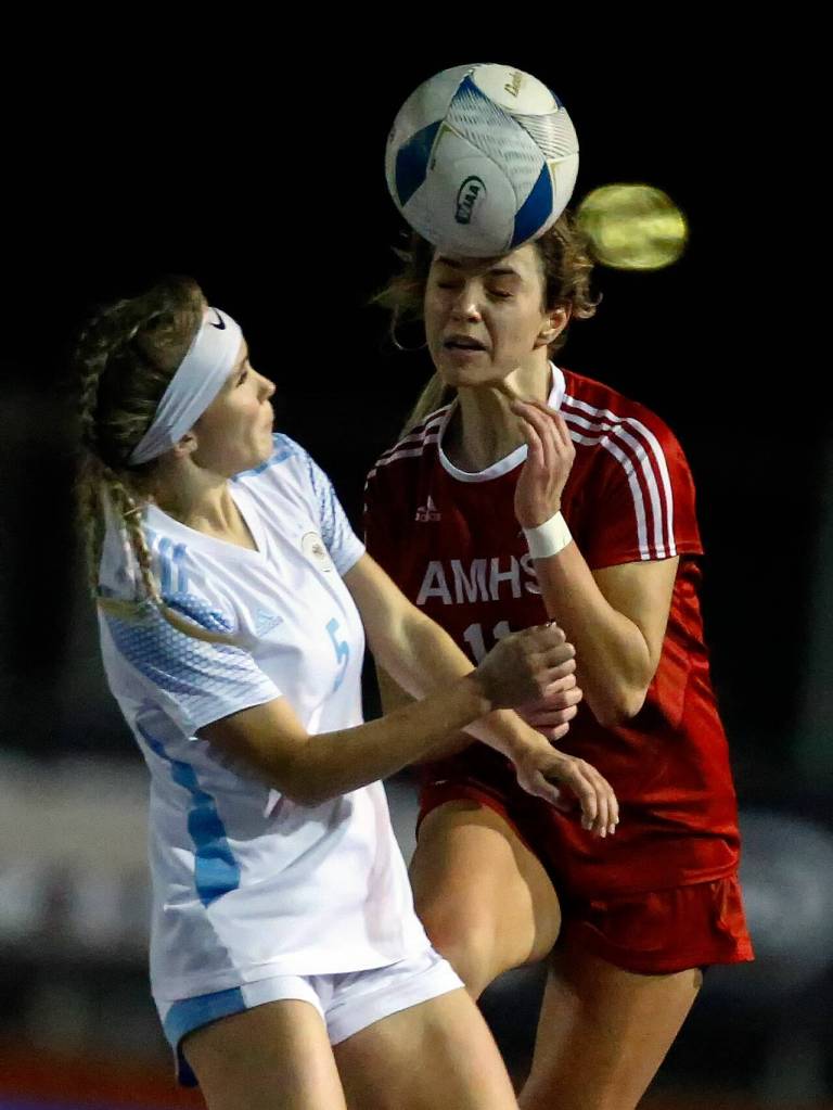 Archbishop Murphys Taylor Campbell, right, heads the ball with Hockinsons Olivia Rude Saturday afternoon during the 2A state championship at Shoreline Stadium on November 20, 2021. The Wildcats won 2-0. (Kevin Clark / The Herald)