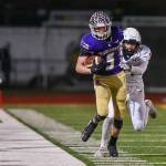 Lake Stevens tight end Cole Becker tip-toes down the sideline after a catch during a 4A state quarterfinal game against Gonzaga Prep on Nov. 20, 2021, at Lake Stevens High School. (John Gardner / Pro Action Image)