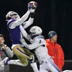 Lake Stevens' Jayden Limar leaps for a catch over a Gonzaga Prep defender during a 4A state quarterfinal game on Nov. 20, 2021, at Lake Stevens High School. (John Gardner / Pro Action Images)