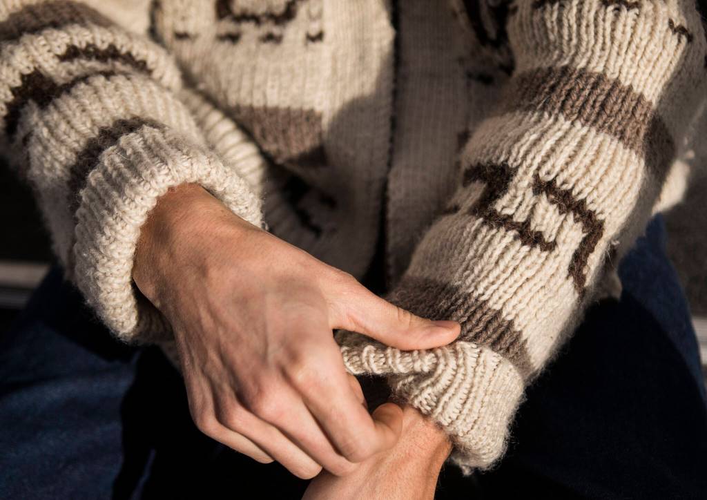 Jacob Akers in his Dude sweater. (Olivia Vanni / The Herald)