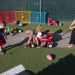School-age lead Emilee Swenson pulls kids around in a wagon at Tomorrows Hope child care center on Sept. 7, in Everett. The city of Everett is considering using federal funds for a grant that would help a nonprofit group launch a day care center at Everett Station. (Andy Bronson / Herald file photo)