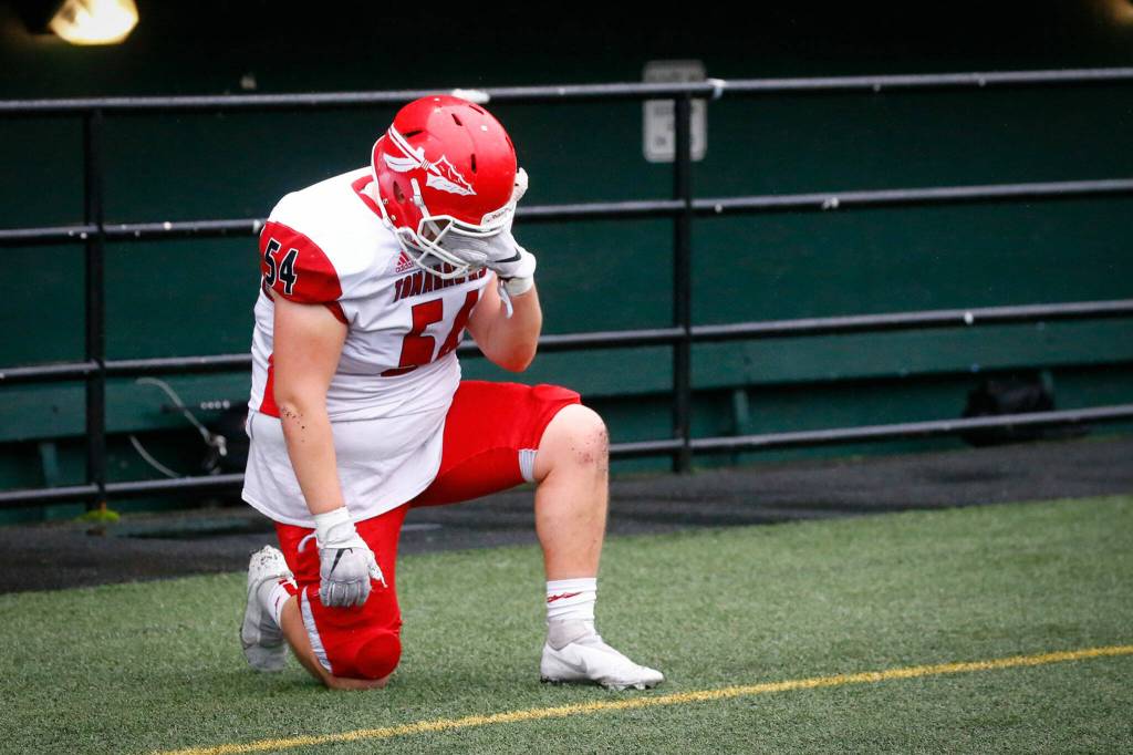 Marysville-Pilchucks Elijah French reacts in the closing seconds of the game against Bellevue High Saturday afternoon at Memorial Stadium in Seattle on November 27, 2021. The Tomahawks fell to the Wolverines 27-3 ending their playoff run. (Kevin Clark / The Herald)