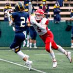 Marysville-Pilchucks Dylan Carson breaks up a pass intended for Bellevues Chase Taylor Saturday afternoon at Memorial Stadium in Seattle on November 27, 2021. The Tomahawks fell to the Wolverines 27-3 ending their playoff run. (Kevin Clark / The Herald)