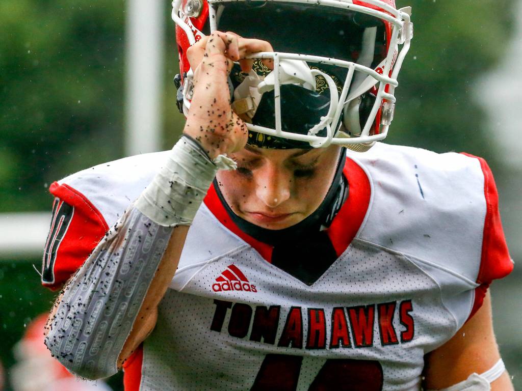 Marysville-Pilchucks Jordan Velasquez during a injury time out Saturday afternoon at Memorial Stadium in Seattle on November 27, 2021. The Tomahawks fell to the Wolverines 27-3 ending their playoff run. (Kevin Clark / The Herald)