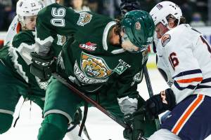Silvertips forward Alex Swetlikoff (90) battles for the loose puck during a game against Kamloops on Saturday, Nov. 27, 2021, at Angel of the Winds Arena in Everett. (Kristin Ostrowski / Everett Silvertips)