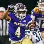 Lake Stevens' Trayce Hanks eludes defenders during a 4A state quarterfinal game against Gonzaga Prep on Nov. 20, 2021, at Lake Stevens High School. (John Gardner / Pro Action Image)