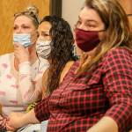 Allison Smith (left to right), Jamie Gonzales and Jodie Aney listen during the sentencing of Jeremy Pidgeon in Snohomish County District Court in Monroe on June 23, 2021.  (Kevin Clark / The Herald)