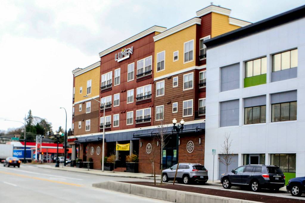 Lobsang Dargey turned a former car lot in Everett into a 108-unit apartment building, Lumen Apartments, which opened in 2011. (Kevin Clark / The Herald)