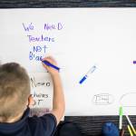 Kids write down their thoughts about the proposed closing of the Early Learning Center. (Olivia Vanni / The Herald)