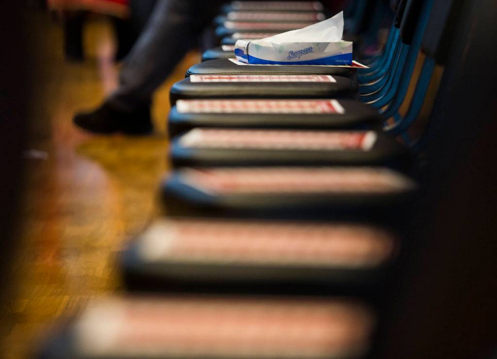 A box of tissues and a row of chairs at a gathering to support the continued search for Mary Ellen Johnson-Davis, a missing Tulalip Tribes member. (Olivia Vanni / The Herald)