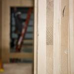 A view of a cross-laminated timber modular home under construction inside a warehouse on Marine View Drive in Everett. (Andy Bronson / The Herald)