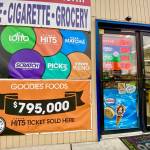 A banner outside the door of Goodies in Mountlake Terrace says, $795,000 Hit 5 ticket sold here. (Andrea Brown / The Herald)