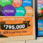 A banner outside the door of Goodies in Mountlake Terrace says, “$795,000 Hit 5 ticket sold here.” (Andrea Brown / The Herald) 20211201