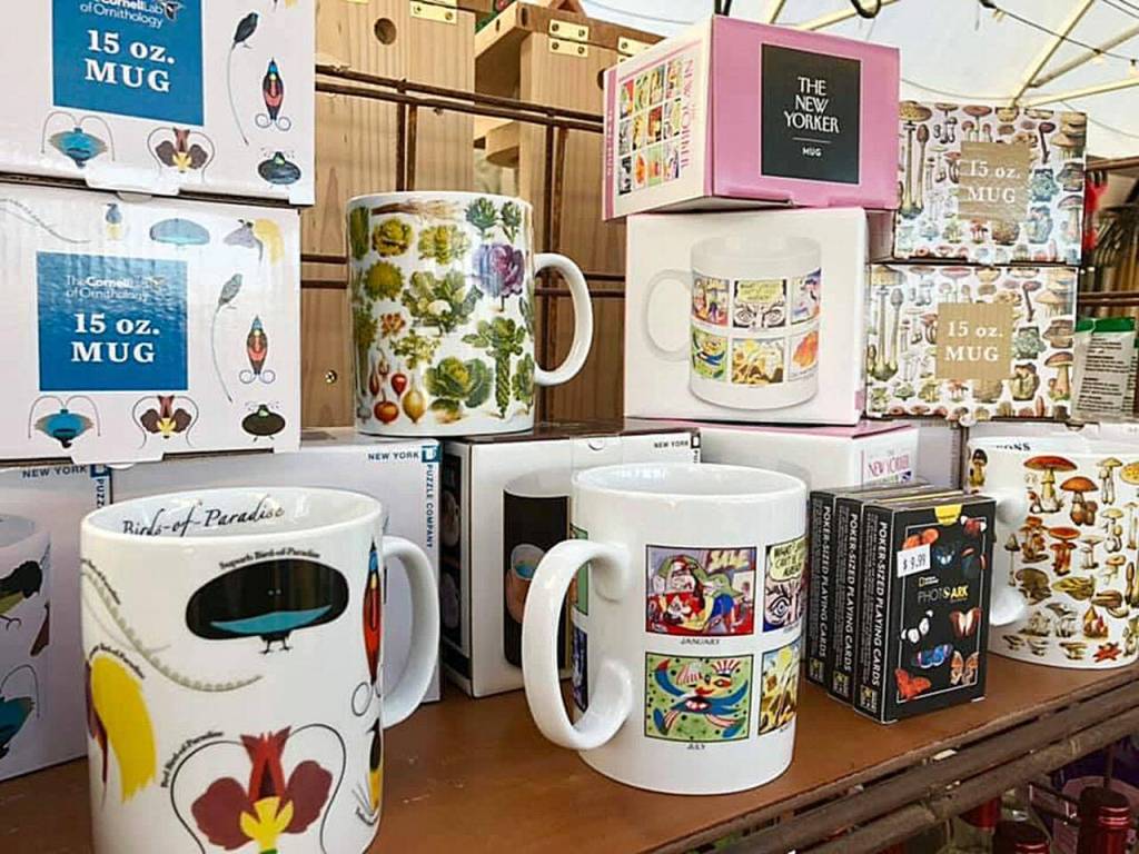 Whimsical garden-themed mugs.