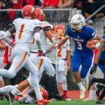 Standout dual-threat quarterback Joshua Wood and the Eagles have steamrolled opponents by 41.3 points per game. (Pete Caster / Tacoma News Tribune)