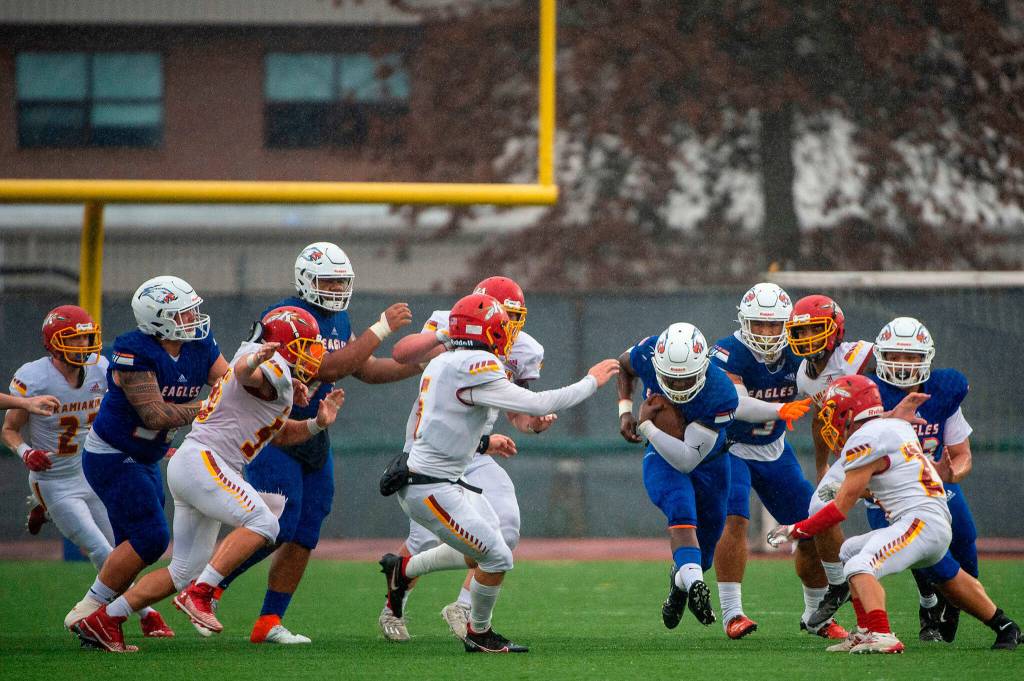 Led by a massive offensive line, the Eagles have run all over opposing defenses. (Pete Caster / Tacoma News Tribune)