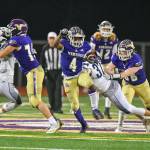 Lake Stevens Trayce Hanks eludes defenders during a 4A state quarterfinal game against Gonzaga Prep on Nov. 20, 2021, at Lake Stevens High School. (John Gardner / Pro Action Image)