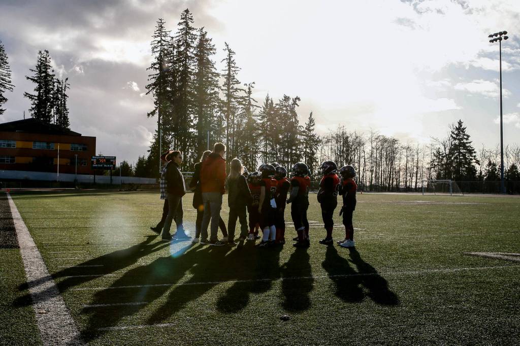 The Marysville Tomahawks take a timeout during the Buddy Bowl Saturday at Marysville Getchell High School in Marysville. (Kevin Clark / The Herald)