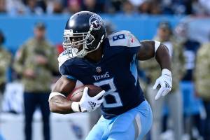Tennessee Titans running back Adrian Peterson (8) carries the ball against the New Orleans Saints in the second half of an NFL football game Sunday, Nov. 14, 2021, in Nashville, Tenn. (AP Photo/Mark Zaleski)