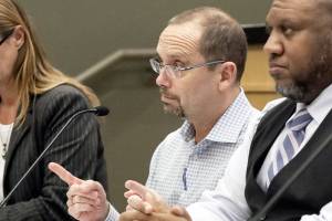 Dr Chris Spitters (center), Interim Health Officer, makes makes his address Monday evening during a Special Meeting of the Snohomish Health District Board of Health at the Administration Builiding in Everett on March 2, 2020.  (Kevin Clark / The Herald)