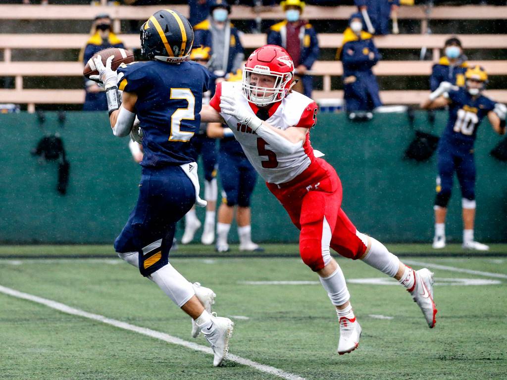 Marysville Pilchucks Dylan Carson breaks up a pass intended for Bellevues Chase Taylor during the a Class 3A semifinal game on Nov. 27, 2021 at Memorial Stadium in Seattle. (Kevin Clark / The Herald)
