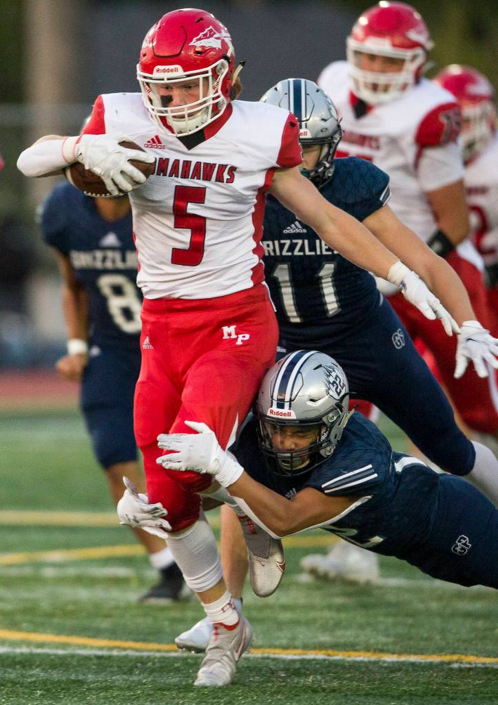 Marysville Pilchucks Dylan Carson runs with the ball during a game against Glacier Peak on Sept. 24, 2021 in Snohomish. (Olivia Vanni / The Herald)