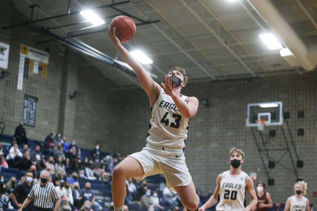Arlingtons Ethan Martin makes a fast break to the basket as Arlington took on Lakewood in a game on Wednesday, May 19, 2021 in Arlington, Washington. (Andy Bronson / The Herald)