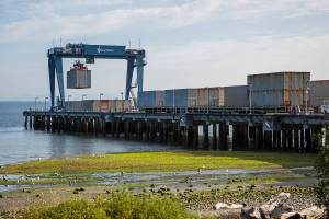 Airplane cargo for the Boeing plant in Everett is offloaded from a barge on Aug. 13, 2020 in Mukilteo. Aerospace products and parts manufacturing lost the most jobs out of any manufacturing industry in Snohomish County in the past year. (Olivia Vanni / Herald file)