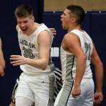 Glacier Peaks Bobby Siebers, left, celebrates receiving a charge call with teammate Torey Watkins during a game against Stanwood on Friday evening at Glacier Peak High School in Snohomish. The Grizzlies won 66-54. (Kevin Clark / The Herald)