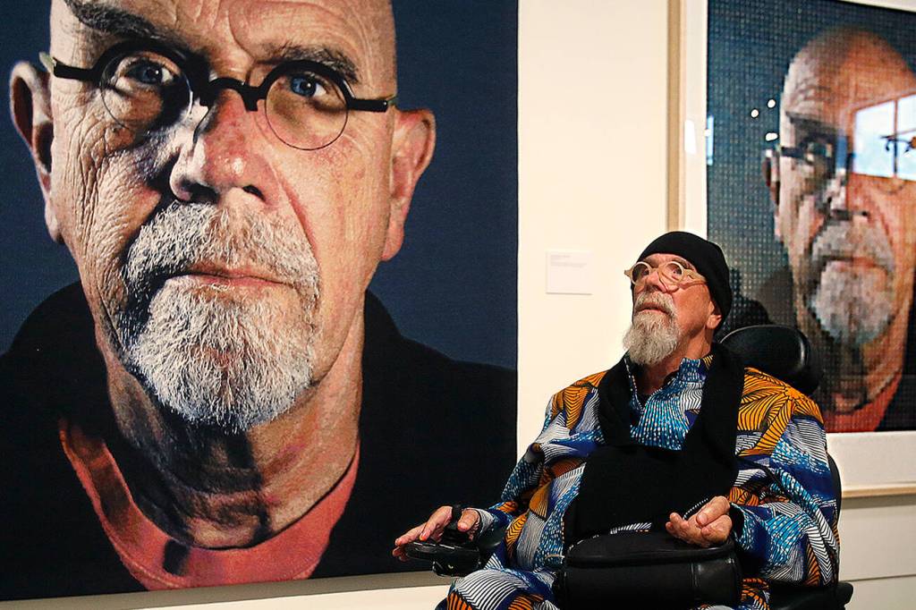 Chuck Close takes in his works during a 2016 exhibit at the Schack Art Center in Everett. (Dan Bates / The Herald)